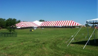 Image of one side of 86 X red and white tent in shape of a T