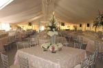 Wedding tent with elegant table decorations and liner