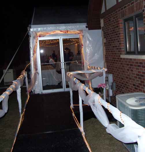 Party tent entryway with double glass doors and black carpet