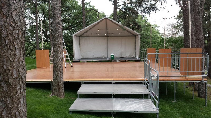 view of covered stage and open air dance floor