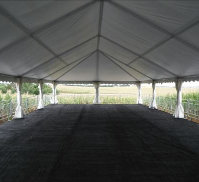 view of empty tent with carpet set on decking