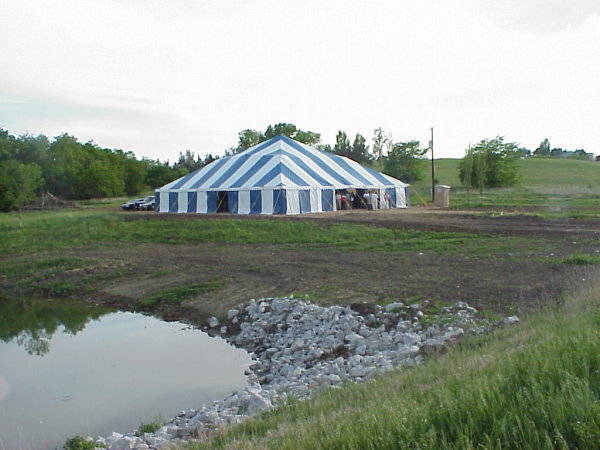 Image of blue & white 60 X 60 tent for a wedding reception