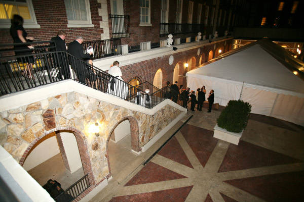 Image of guest descending stairs to enter wedding tent