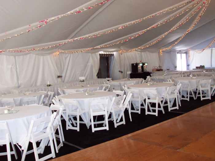 Inside view Clear Span Tent with Dance Floor and Carpet - decorating with tulle, rose garlands and christmas lights