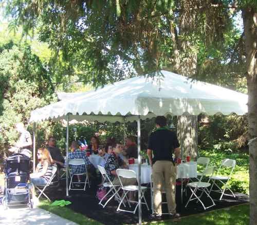 Image of backyard party using a small frame tent