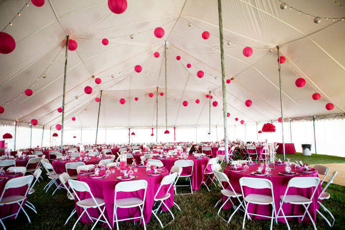 60 X 90 white wedding tent rental in NE decorated in pink