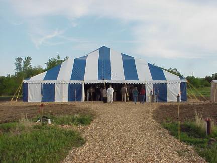 Large Blue & White Commercial Pole Tent set in the country