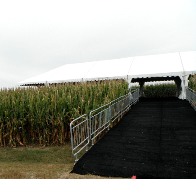 view of entry ramp to tent set in corn field