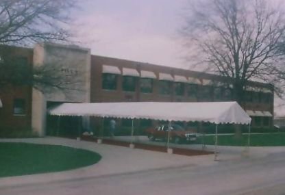 IMAGE of white entryway canopy to school entrance