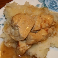 a gluen and dairy free creamed chicken served over mashed potatoes