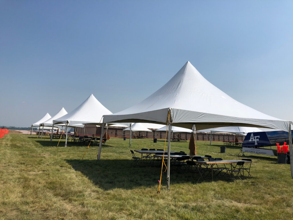 Tension top graduation party tent setup in Lincoln Nebraska backyard event